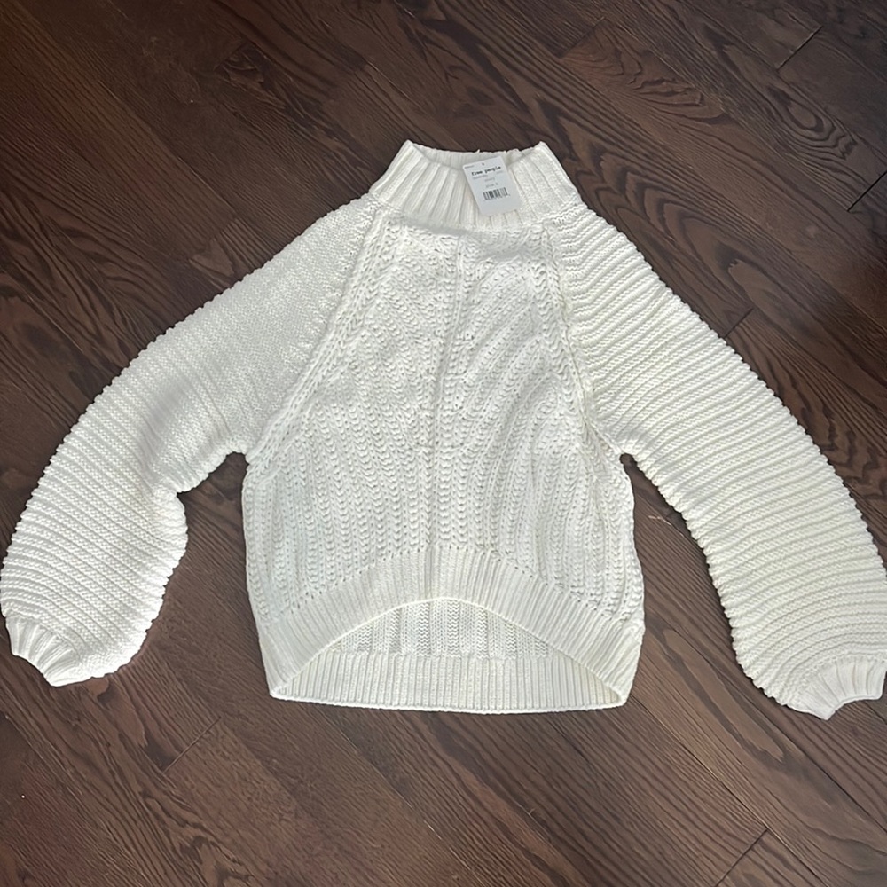 Free People cable knit sweater.